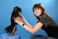 The girl with the doggie on a blue background