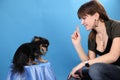 The girl with the doggie on a blue background