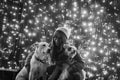 Girl with dogs in black and white and lights in the back