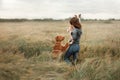 Girl with dogs in the field.