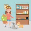Girl and dogs in the vet with food medicine shelf pet care