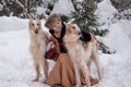 Girl with dogs in the winter