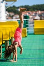 Girl doing cartwheels on Croatian ferryboat in Mali Losinj