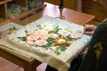 Girl doing embroidery vase with flowers