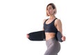 Girl doing fitness back belt slimming isolated on white background
