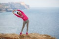 Girl doing gymnastics in the morning on the Beach Ocean Royalty Free Stock Photo