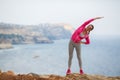 Girl doing gymnastics in the morning on the Beach Ocean Royalty Free Stock Photo