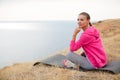 Girl doing gymnastics in the morning on the Beach Ocean Royalty Free Stock Photo