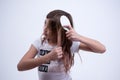 Girl doing a hairstyle in her hair Royalty Free Stock Photo
