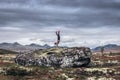 Girl doing handstand in the mountains