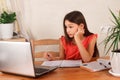 Girl doing homework and watching webinar at laptop.  Distance education, homeschooling, E-learning at home during quarantine Royalty Free Stock Photo