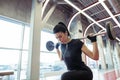 Girl doing lunges with barbell in modern gym Royalty Free Stock Photo