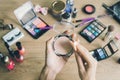 Girl doing makeup on dressing table Royalty Free Stock Photo