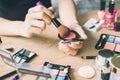 Girl doing makeup on dressing table Royalty Free Stock Photo