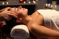 Girl doing relaxation head massage in beauty salon Royalty Free Stock Photo