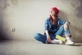 The girl is doing repairs in the apartment. Home moving to a new apartment. The worker makes repairs, plastered and Royalty Free Stock Photo