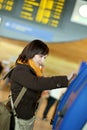 Girl doing self-checkin in the airport Royalty Free Stock Photo