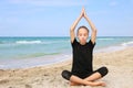 Girl doing sports exercises on the beach Royalty Free Stock Photo