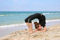 Girl doing sports exercises on beach Royalty Free Stock Photo