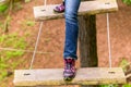 Girl doing step on rope bridge Royalty Free Stock Photo