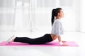 Girl doing warming up exercise for spine, backbend Royalty Free Stock Photo