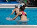 Girl Doing Water Exercises with Bike Outdoor in a Swimming Pool Royalty Free Stock Photo