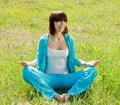 Girl doing yoga against nature Royalty Free Stock Photo