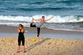 Girl doing yoga on the beach Royalty Free Stock Photo