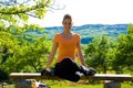 Girl doing yoga outdoors Royalty Free Stock Photo