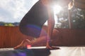 The girl is doing yoga. Young athletic woman trainer practicing yoga instructor individual training. balancing pose, modern gym,