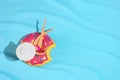 Girl Doll sunbathing in summer donut inflatable toy in swimming pool. Royalty Free Stock Photo