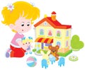 Girl with a doll and toy house Royalty Free Stock Photo