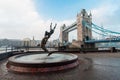 Girl with the Dolphin statue and Tower Bridge