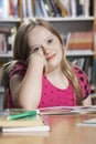 Girl (10-12) with Down syndrome in classroom Royalty Free Stock Photo