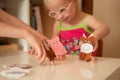 A girl with Down syndrome develops fine motor skills.