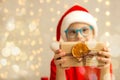 A girl with Down syndrome holds a New Year's gift