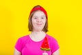 Girl Down syndrome with large Lollipop Royalty Free Stock Photo