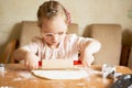 Girl with Down Syndrome learns to roll dough