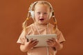 Girl with Down Syndrome Listening to Music in Studio Royalty Free Stock Photo