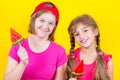 Girl Down syndrome and little girl with large Lollipop Royalty Free Stock Photo