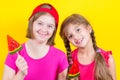 Girl Down syndrome and little girl with large Lollipop Royalty Free Stock Photo