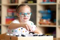 Girl with Down Syndrome playing checkers