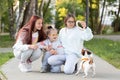 A girl with Down syndrome plays with her sisters while walking the dog Jack Russell