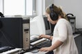 Girl (10-12) with Down syndrome recording sound in home studio Royalty Free Stock Photo