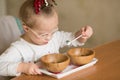 A girl with Down syndrome are trained at Montessori