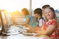 Girl with Down syndrome using computer at school Royalty Free Stock Photo