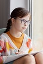Girl With Down Syndrome By Window Royalty Free Stock Photo