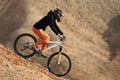 Girl downhill on mountain bike Royalty Free Stock Photo