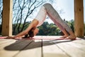 Girl in downward facing dog pose Royalty Free Stock Photo