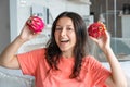 Girl and dragon fruit. Joyful girl enjoying tropical fruits Royalty Free Stock Photo